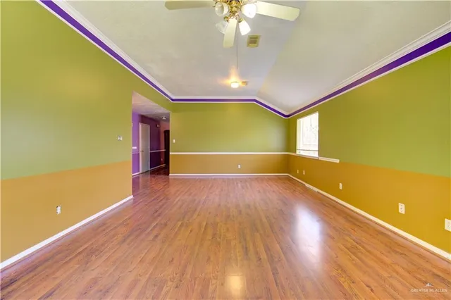 a view of a room with wooden floor