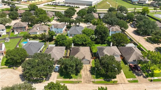 an aerial view of a house with a garden