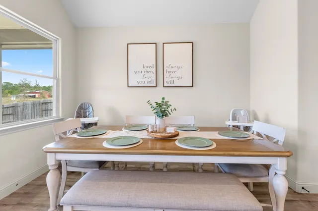 a kitchen with a table and chairs