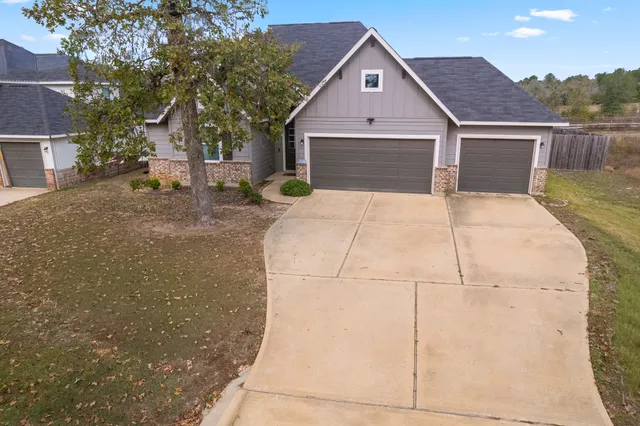 a front view of a house with yard