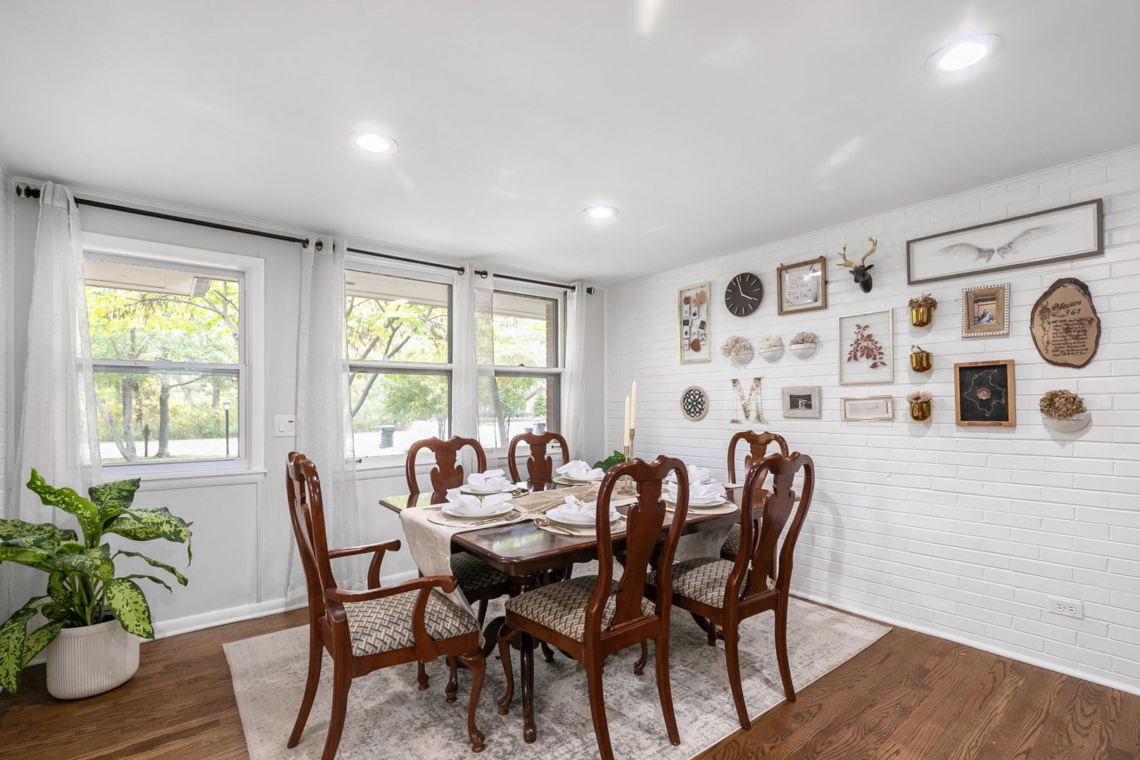 124 West Old Elm Road Lake Forest, IL 60045 - Photo 11 of 31 a view of a dining room with furniture and wooden floor