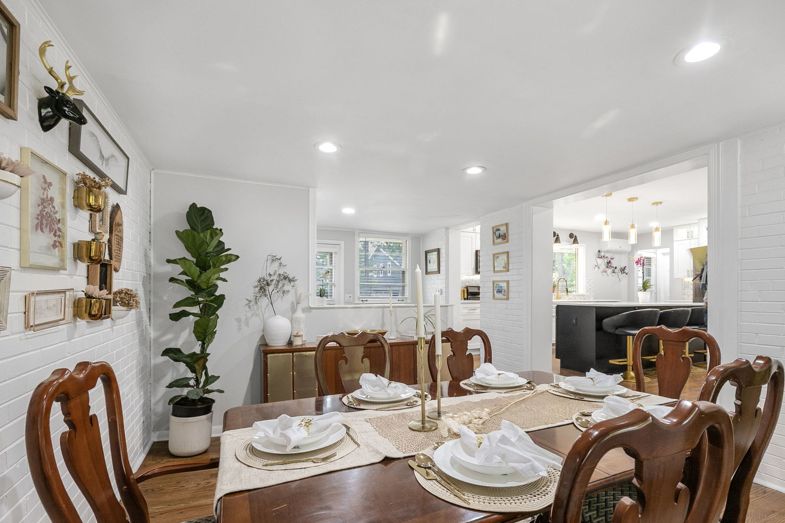 124 West Old Elm Road Lake Forest, IL 60045 - Photo 12 of 31 a dining room with furniture potted plants and wooden floor