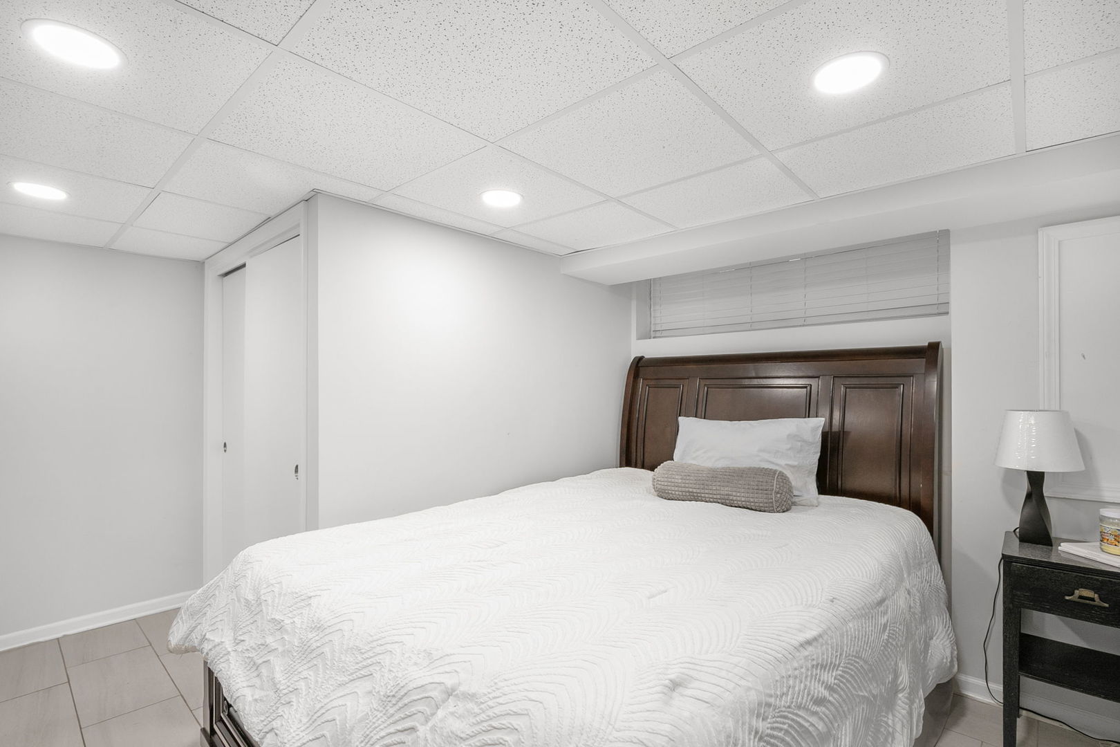 124 West Old Elm Road Lake Forest, IL 60045 - Photo 24 of 31 a bedroom with a bed and a night stand