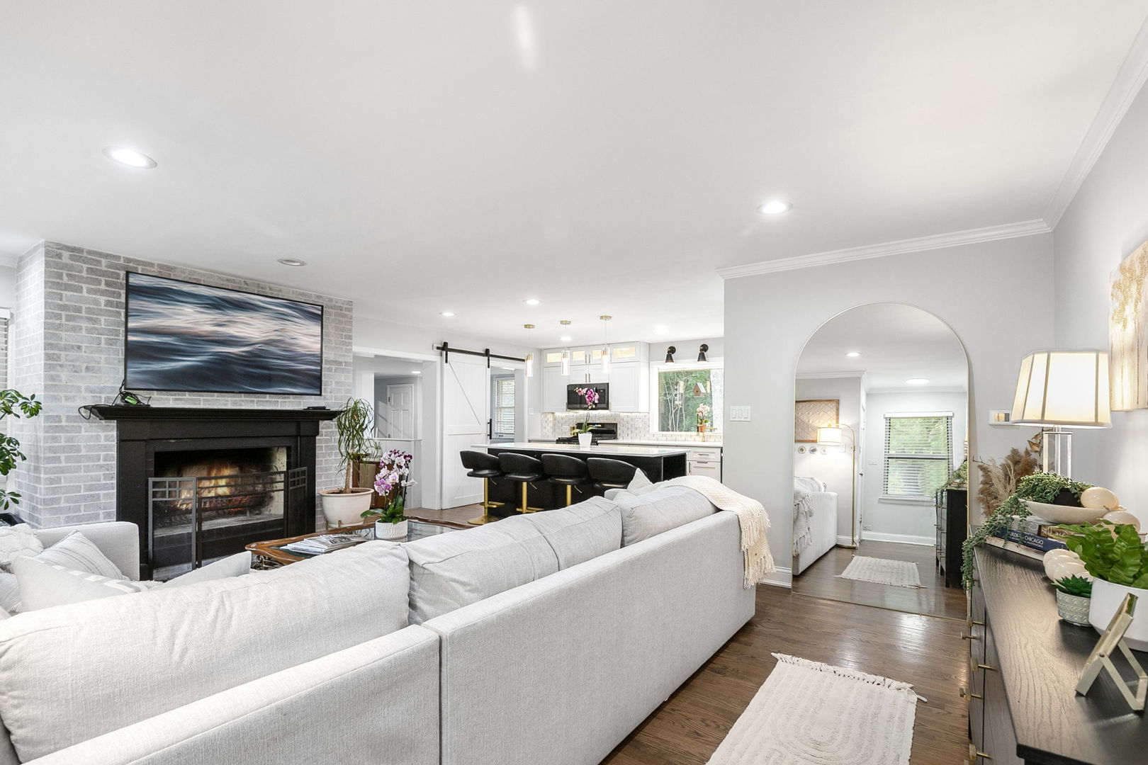 124 West Old Elm Road Lake Forest, IL 60045 - Photo 5 of 31 a living room with furniture a fireplace and a flat screen tv
