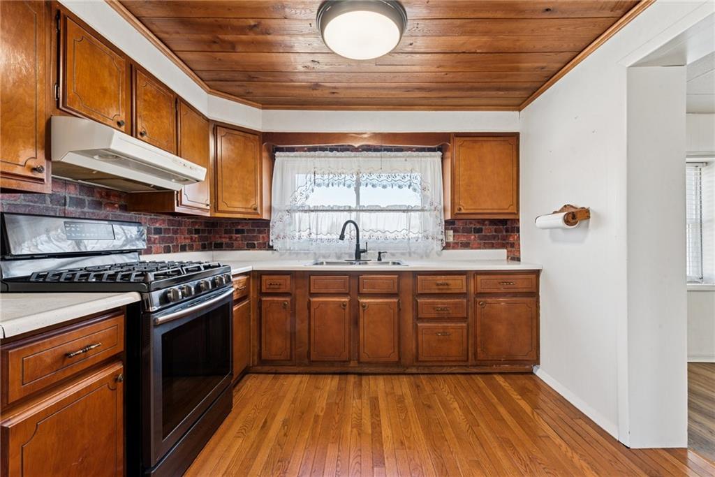3323 State Rte 2011 Scenery Hill, PA 15360 - Photo 11 of 34 a kitchen with stainless steel appliances granite countertop a stove a sink and a refrigerator