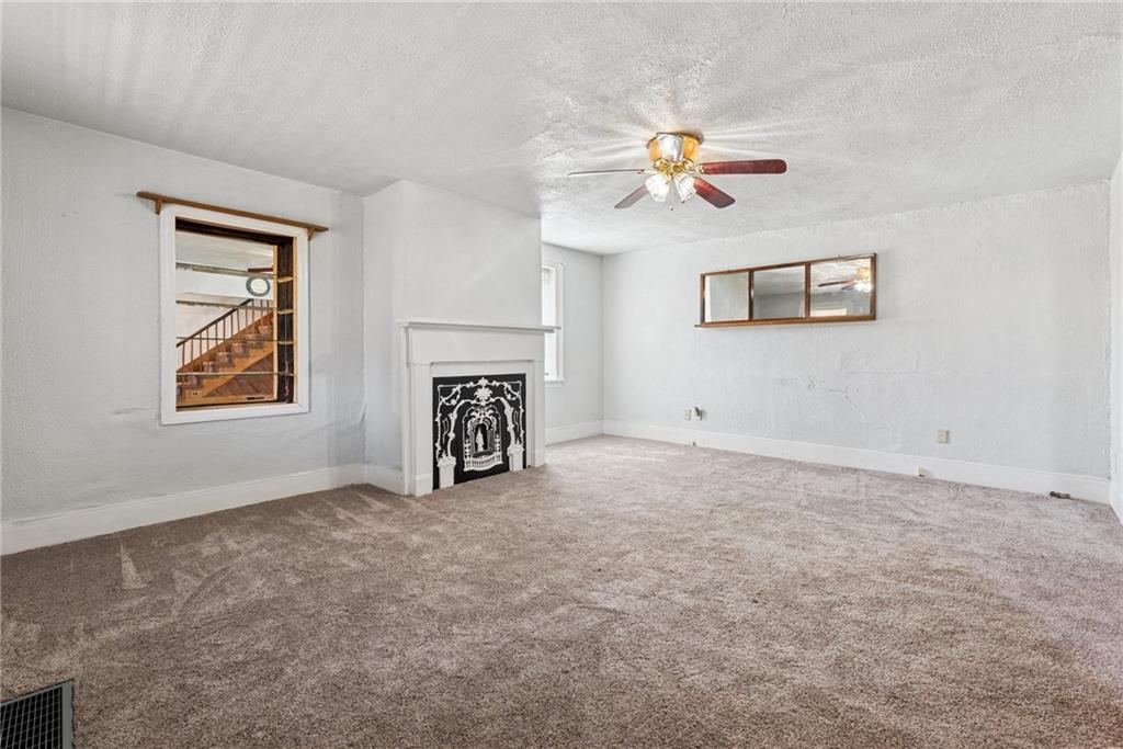 3323 State Rte 2011 Scenery Hill, PA 15360 - Photo 15 of 34 an empty room with windows and fan
