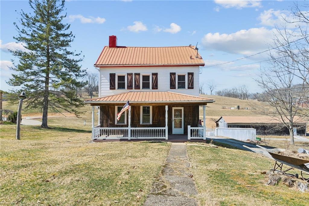 3323 State Rte 2011 Scenery Hill, PA 15360 - Photo 2 of 34 a front view of a house with a yard