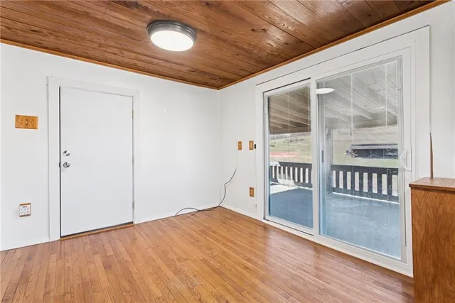 a view of front door with wooden floor