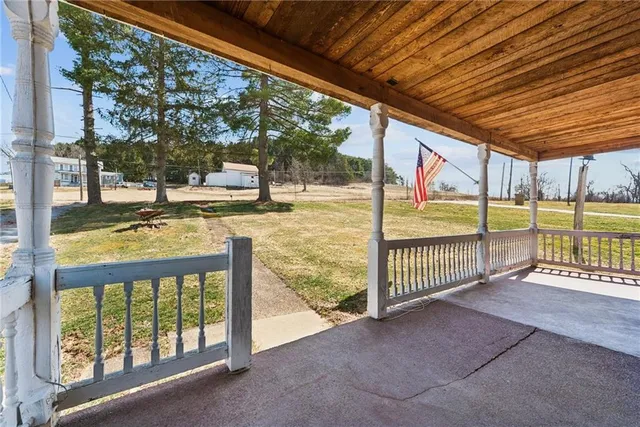 a view of a patio with a yard