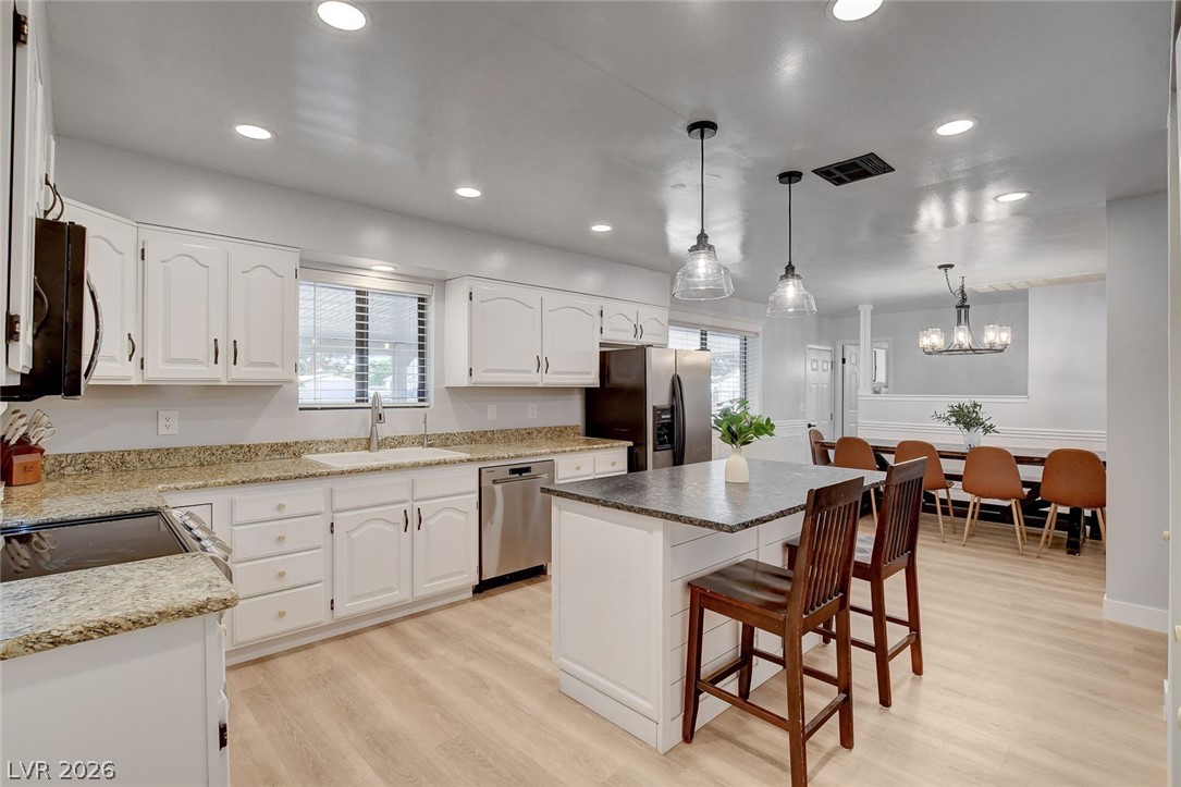 3765 Berkeley Street Logandale, NV 89021 - Photo 31 of 87 This spacious kitchen offers a functional layout with an inviting atmosphere for everyday living and entertaining.