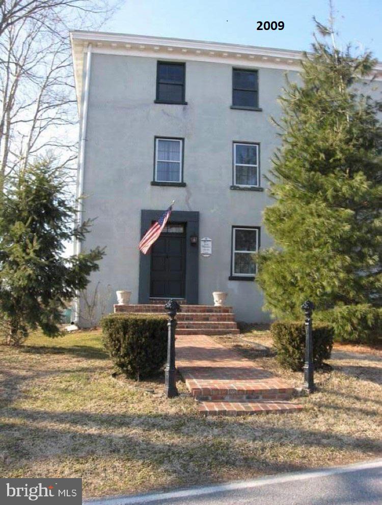 63 Money Island Road Salem, NJ 08079 - Photo 36 of 41 a front view of a house with a yard