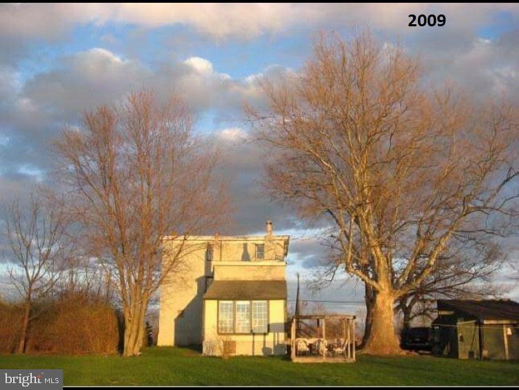 63 Money Island Road Salem, NJ 08079 - Photo 38 of 41 a front view of a house with a yard