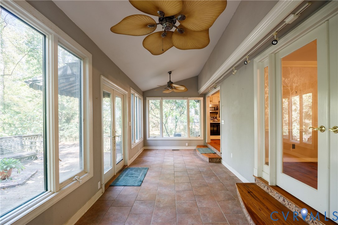 10760 Cherokee Road Midlothian, VA 23113 - Photo 20 of 43 a view of a livingroom with wooden floor and a chandelier fan