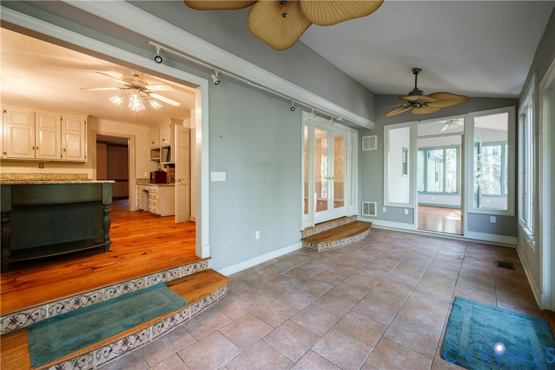 10760 Cherokee Road Midlothian, VA 23113 - Photo 21 of 43 a view of an empty room with window and wooden floor