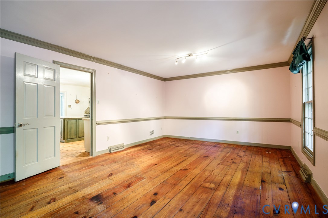 10760 Cherokee Road Midlothian, VA 23113 - Photo 10 of 43 wooden floor in an empty room with a window