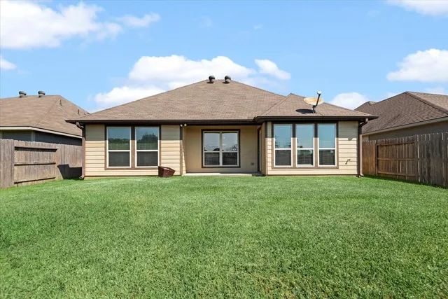 a view of a house with a garden