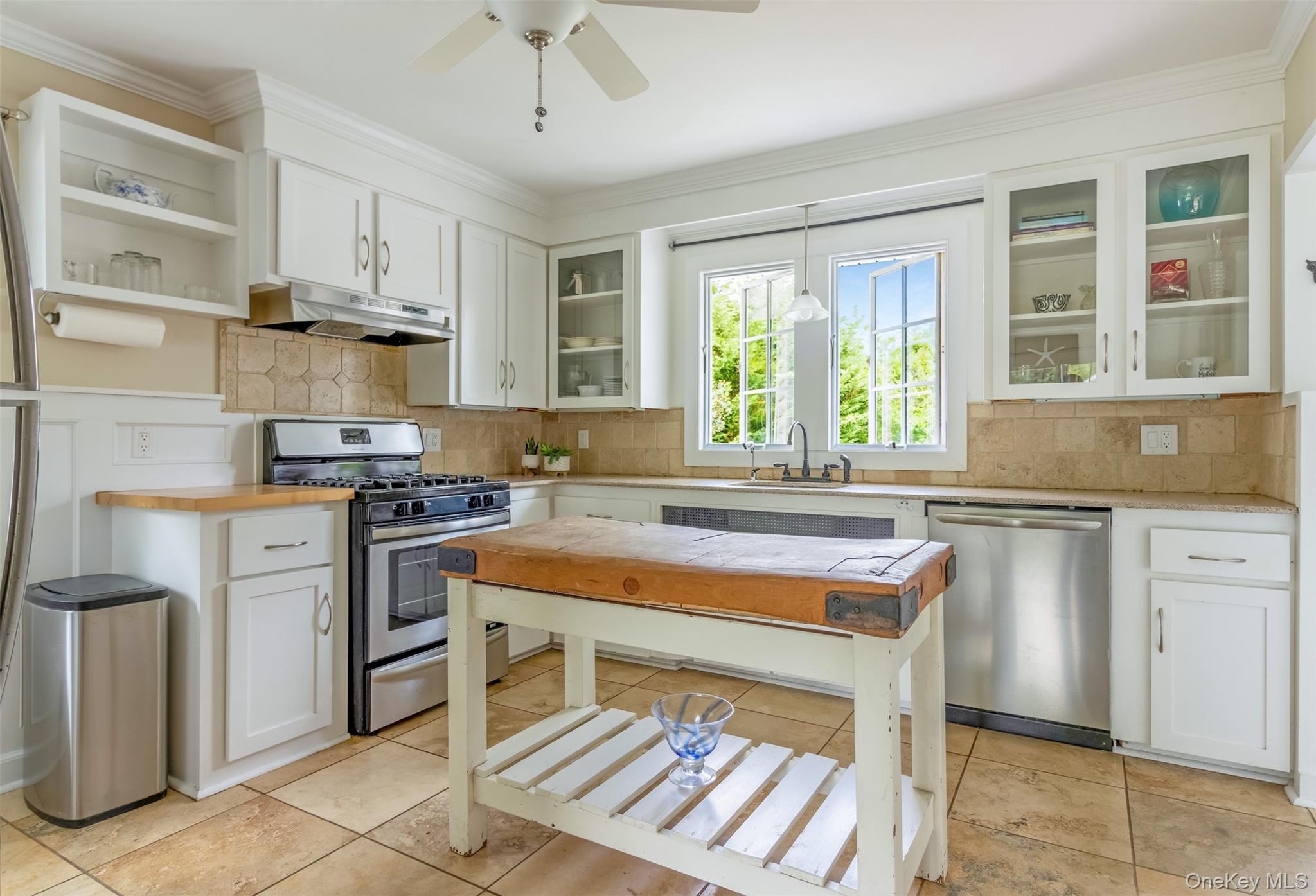 315 Wicks Road New Suffolk, NY 11956 - Photo 9 of 28 a kitchen with stainless steel appliances granite countertop a stove and a refrigerator