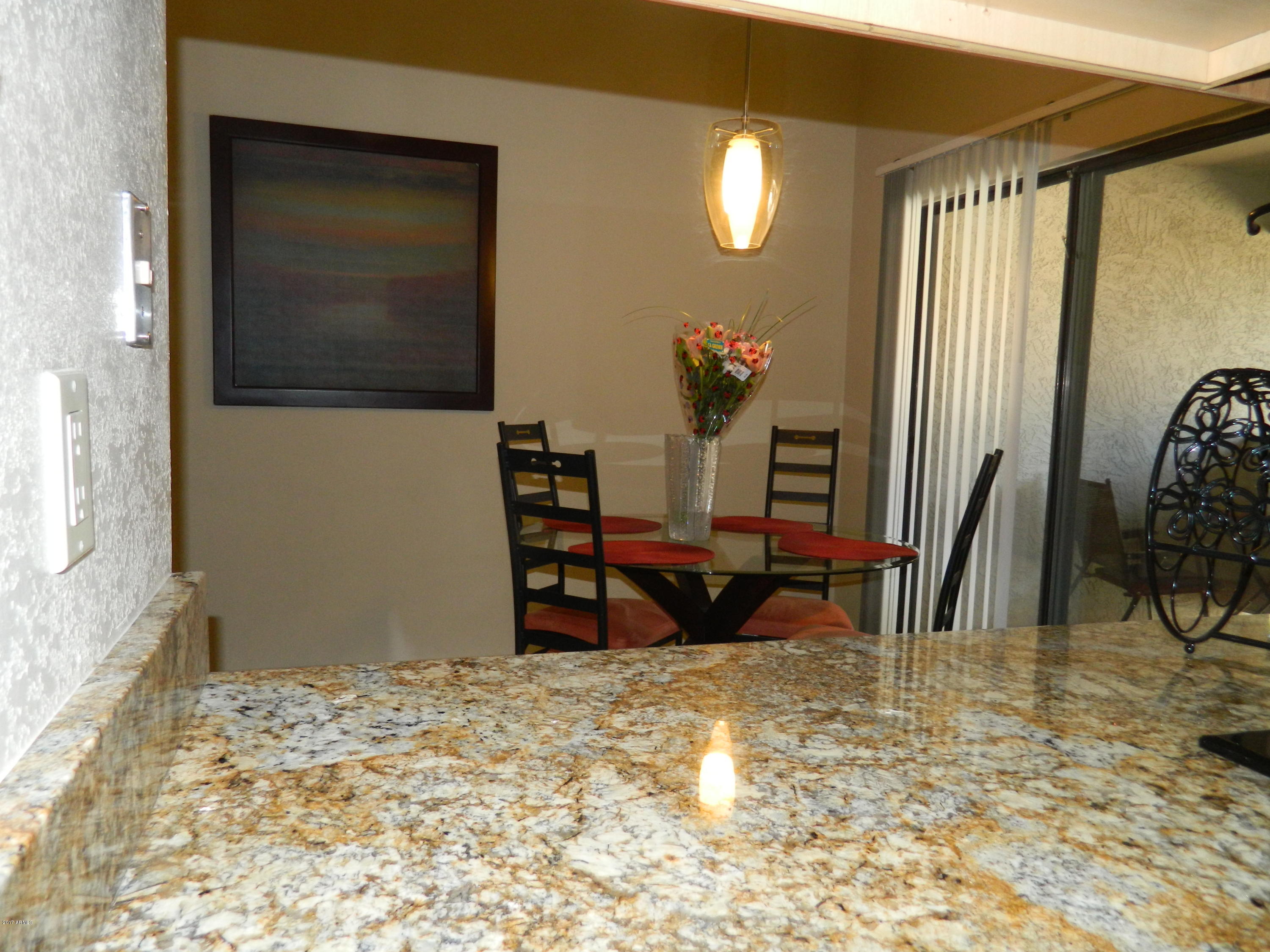 1402 East Guadalupe Road, Unit 245 Tempe, AZ 85283 - Photo 11 of 29 a view of a livingroom with furniture and staircase
