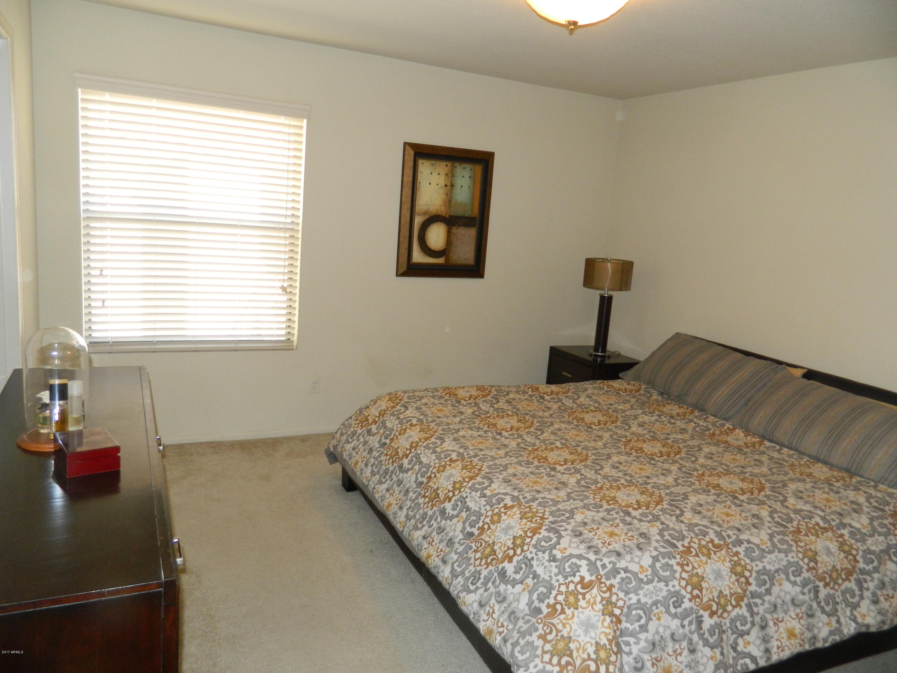 1402 East Guadalupe Road, Unit 245 Tempe, AZ 85283 - Photo 15 of 29 a bedroom with a bed and a window