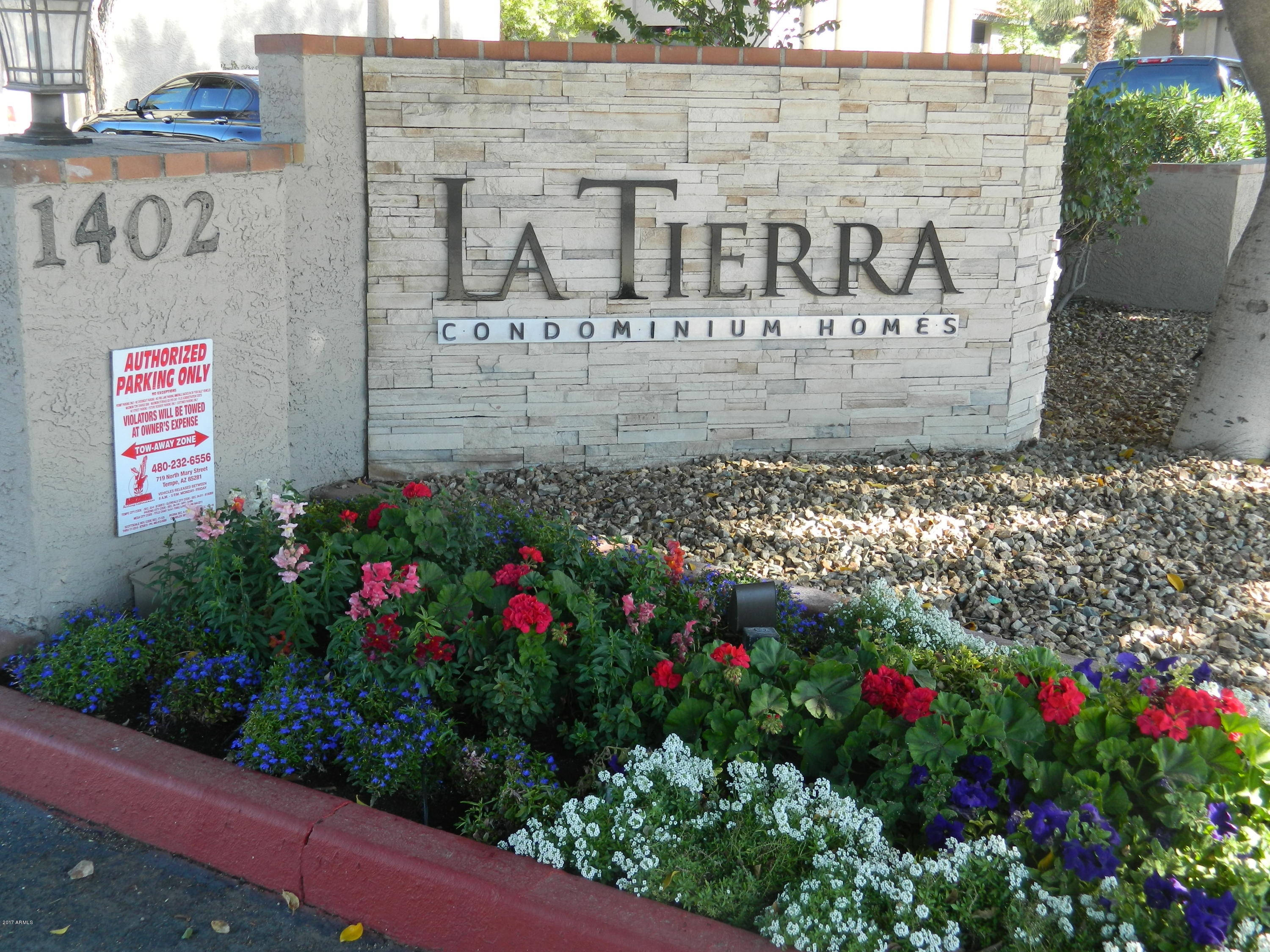 1402 East Guadalupe Road, Unit 245 Tempe, AZ 85283 - Photo 2 of 29 a view of front door of house and flowers