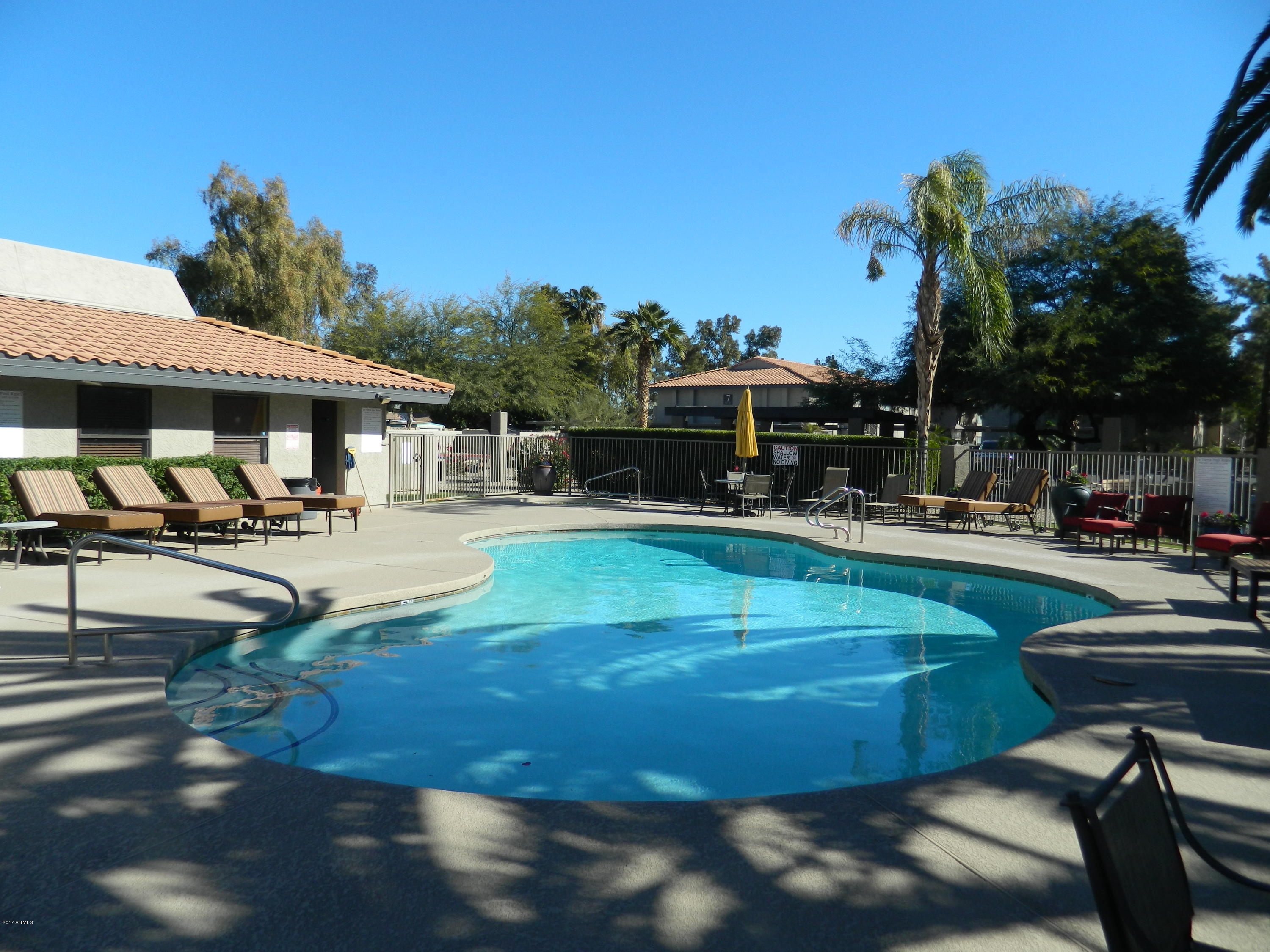 1402 East Guadalupe Road, Unit 245 Tempe, AZ 85283 - Photo 23 of 29 a swimming pool with outdoor seating and yard