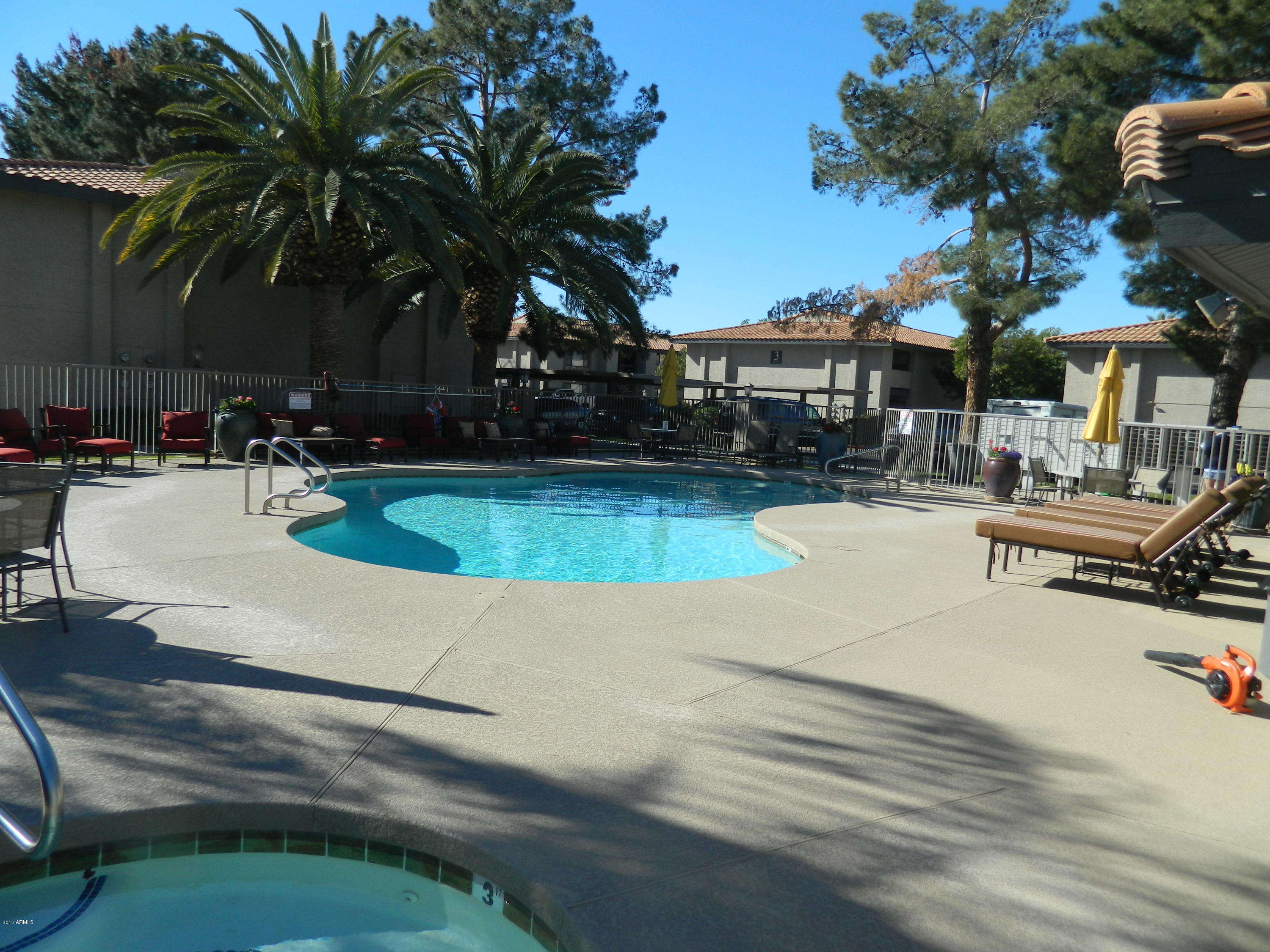 1402 East Guadalupe Road, Unit 245 Tempe, AZ 85283 - Photo 24 of 29 a view of a swimming pool with lounge chairs