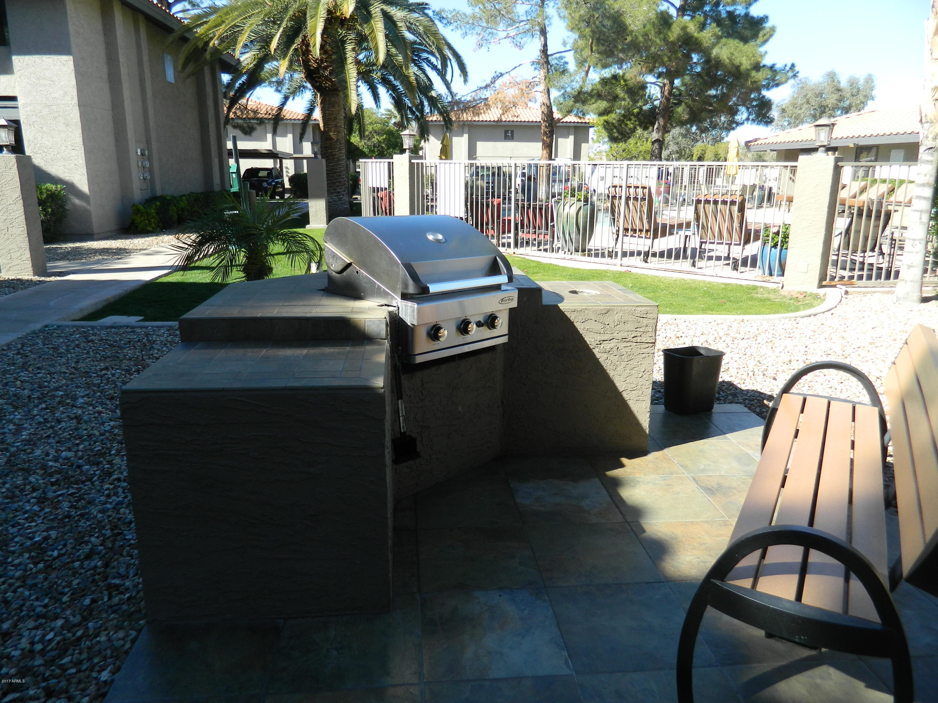 1402 East Guadalupe Road, Unit 245 Tempe, AZ 85283 - Photo 29 of 29 a view of a patio with swimming pool