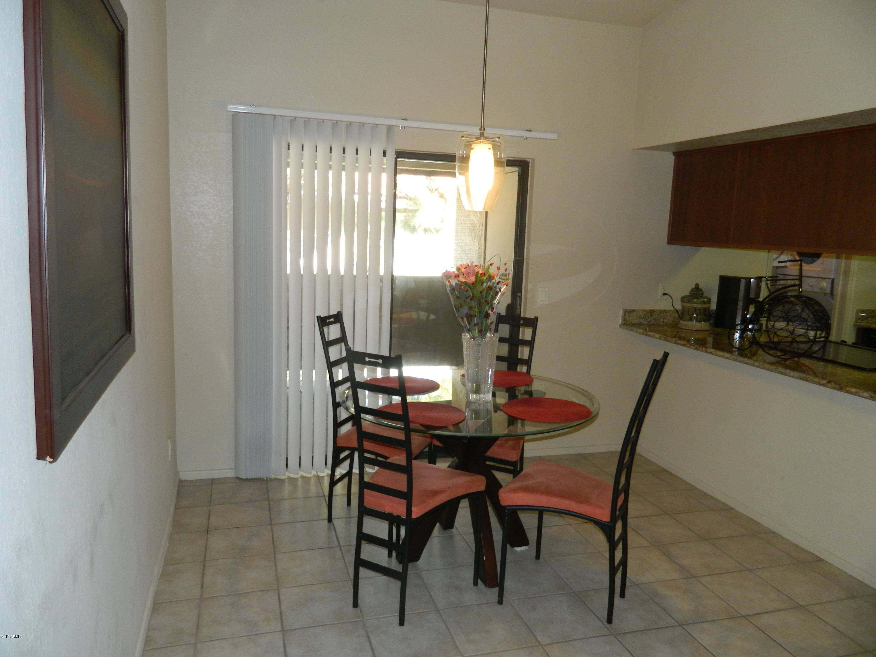 1402 East Guadalupe Road, Unit 245 Tempe, AZ 85283 - Photo 5 of 29 a dining room with furniture and window