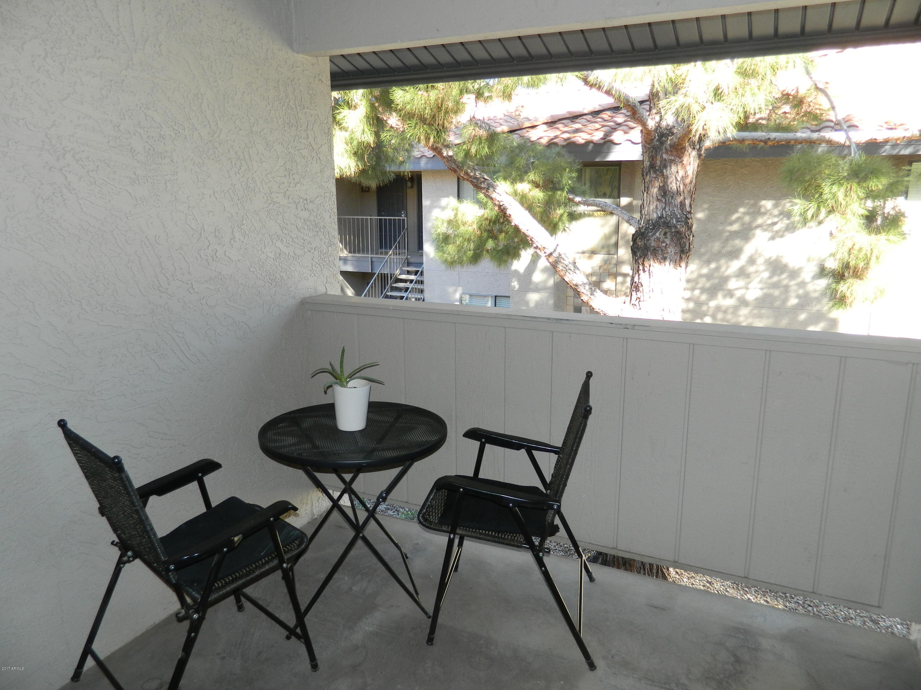 1402 East Guadalupe Road, Unit 245 Tempe, AZ 85283 - Photo 6 of 29 a view of a room with a table and chairs