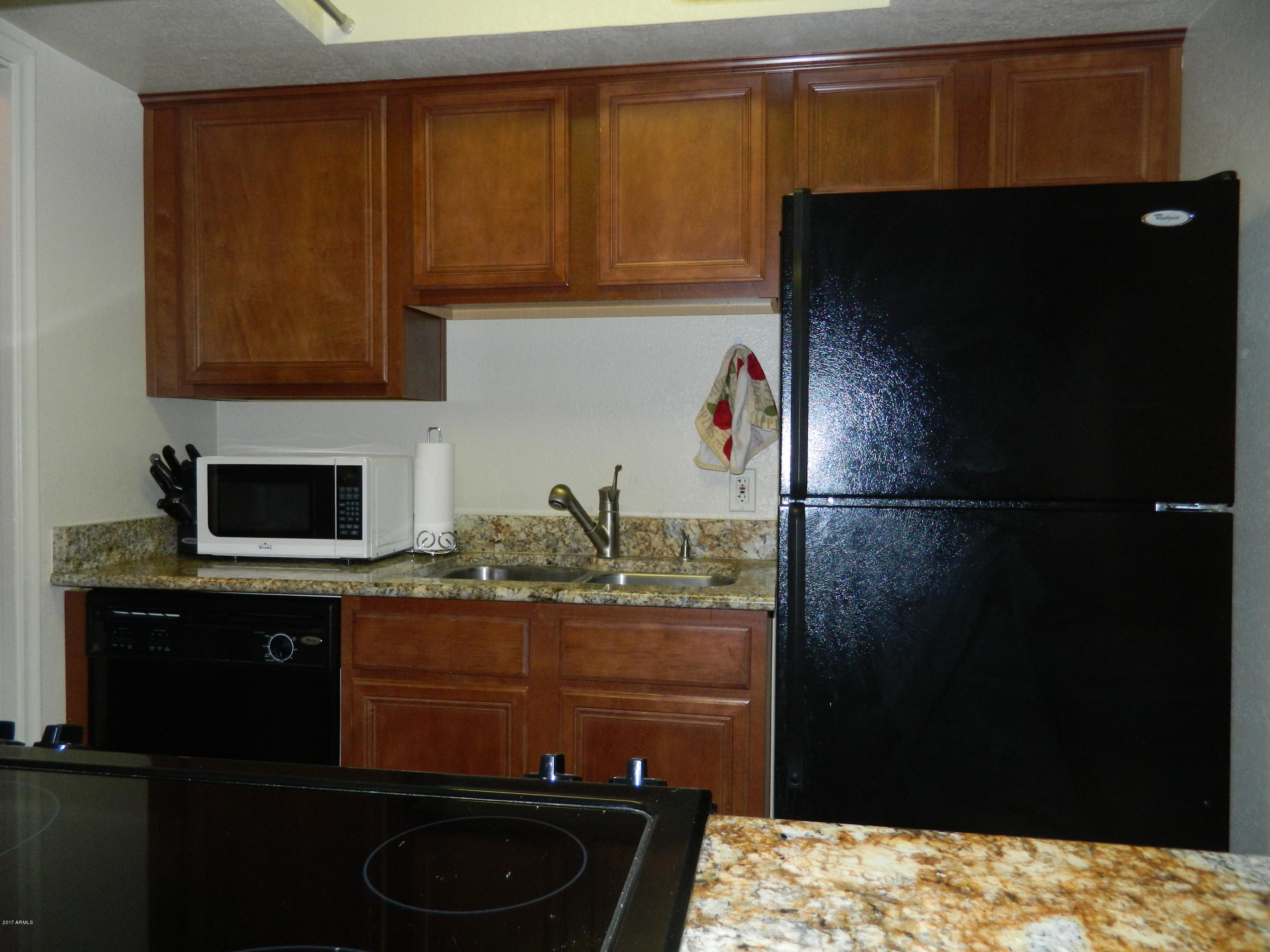 1402 East Guadalupe Road, Unit 245 Tempe, AZ 85283 - Photo 8 of 29 a kitchen with a sink and cabinets