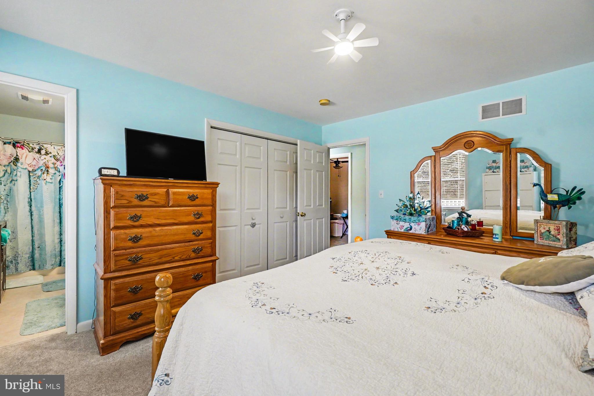 8636 Winding Way Perry Hall, MD 21128 - Photo 11 of 40 a bedroom with a bed and a flat screen tv
