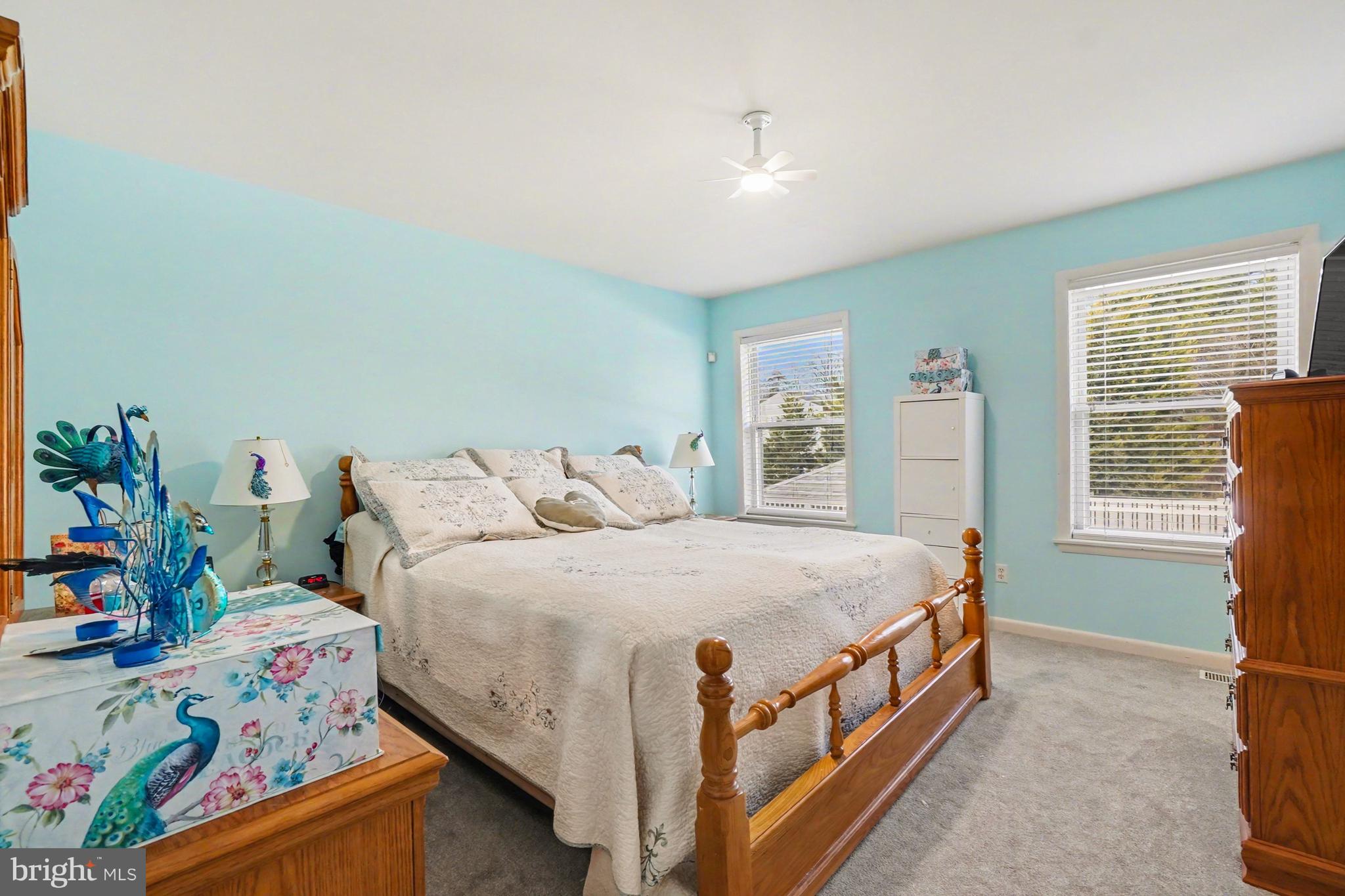 8636 Winding Way Perry Hall, MD 21128 - Photo 12 of 40 a bed sitting in a bedroom next to a window