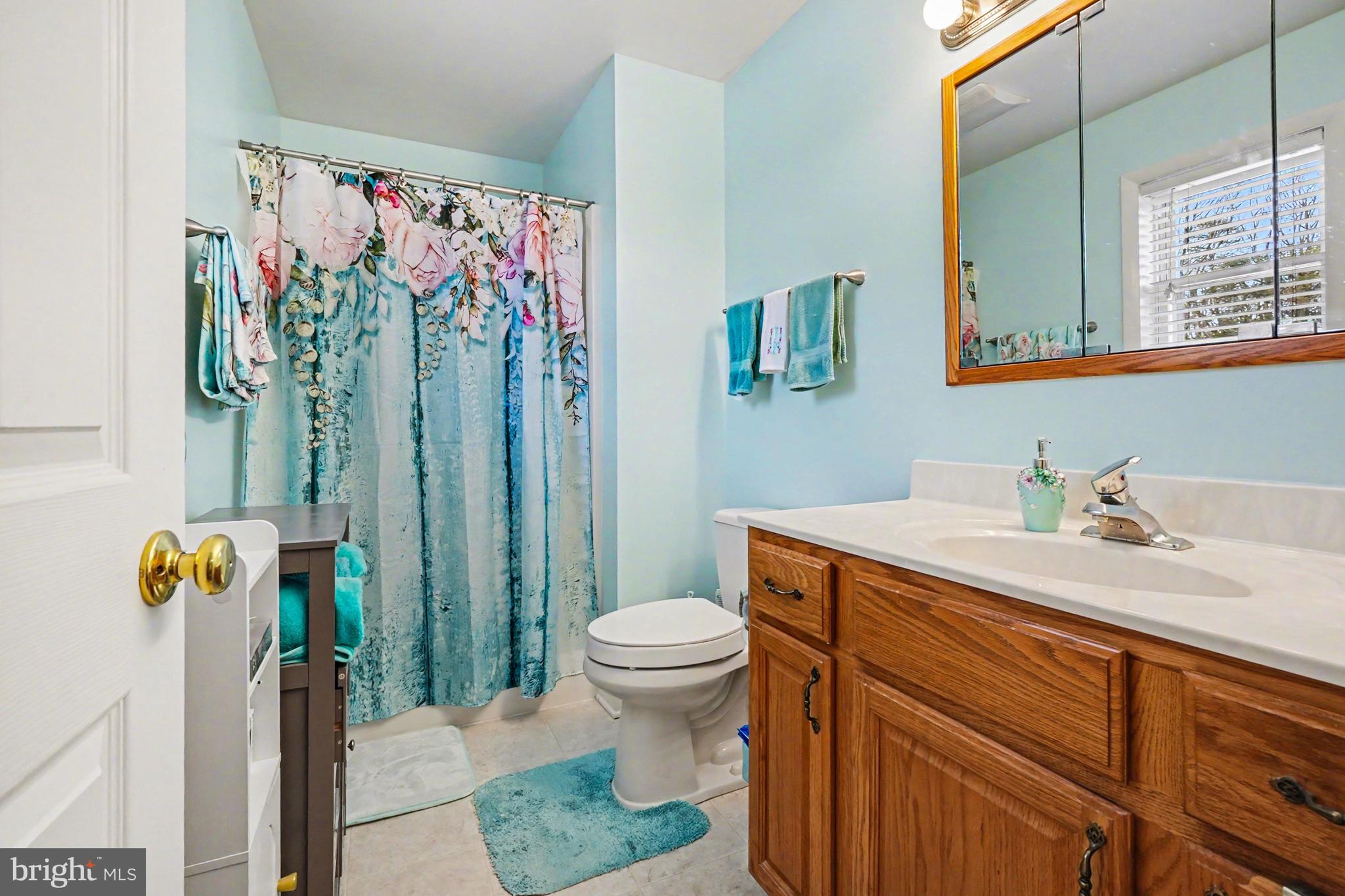 8636 Winding Way Perry Hall, MD 21128 - Photo 13 of 40 a bathroom with a sink toilet and shower
