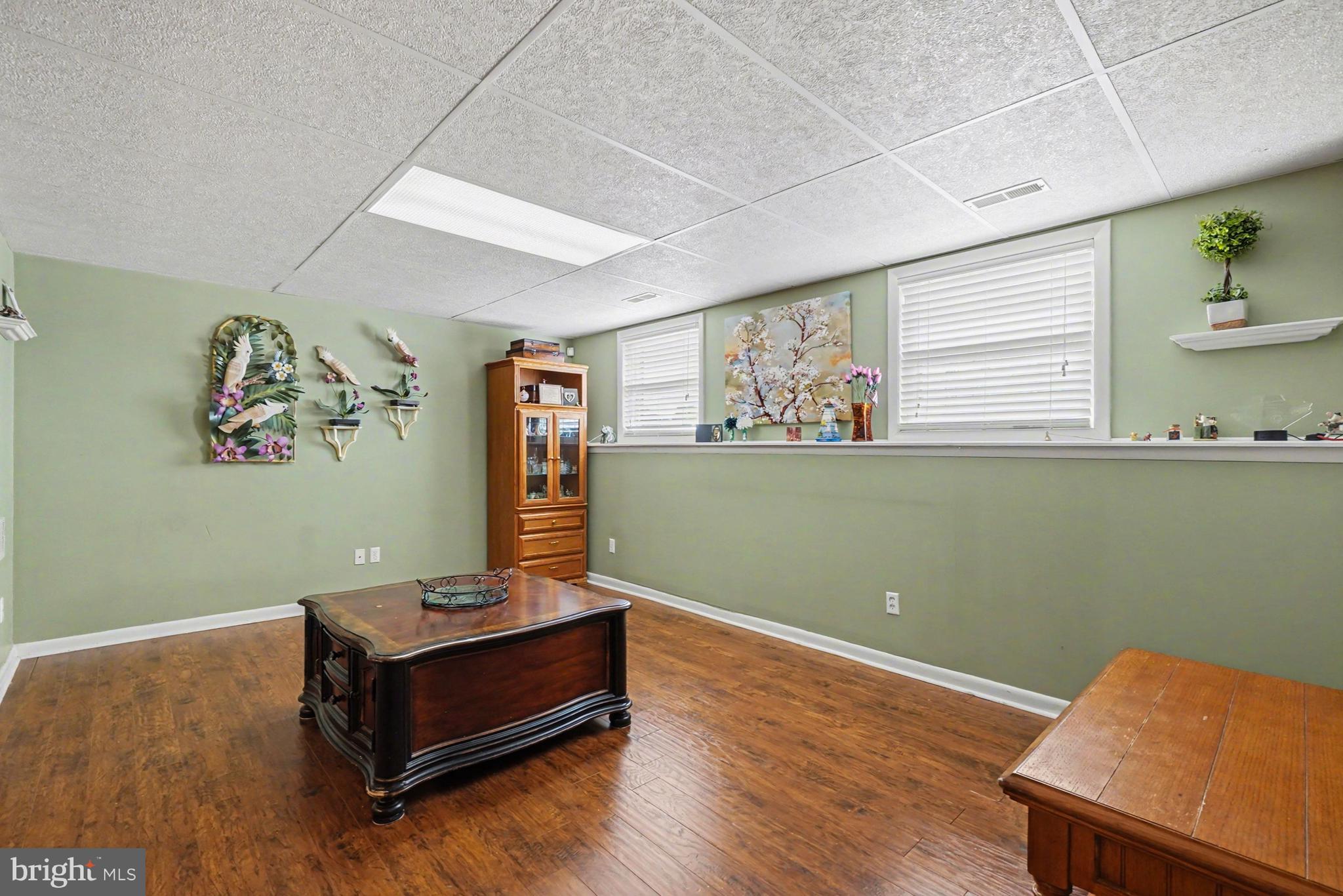 8636 Winding Way Perry Hall, MD 21128 - Photo 19 of 40 a view of room with window and wooden floor