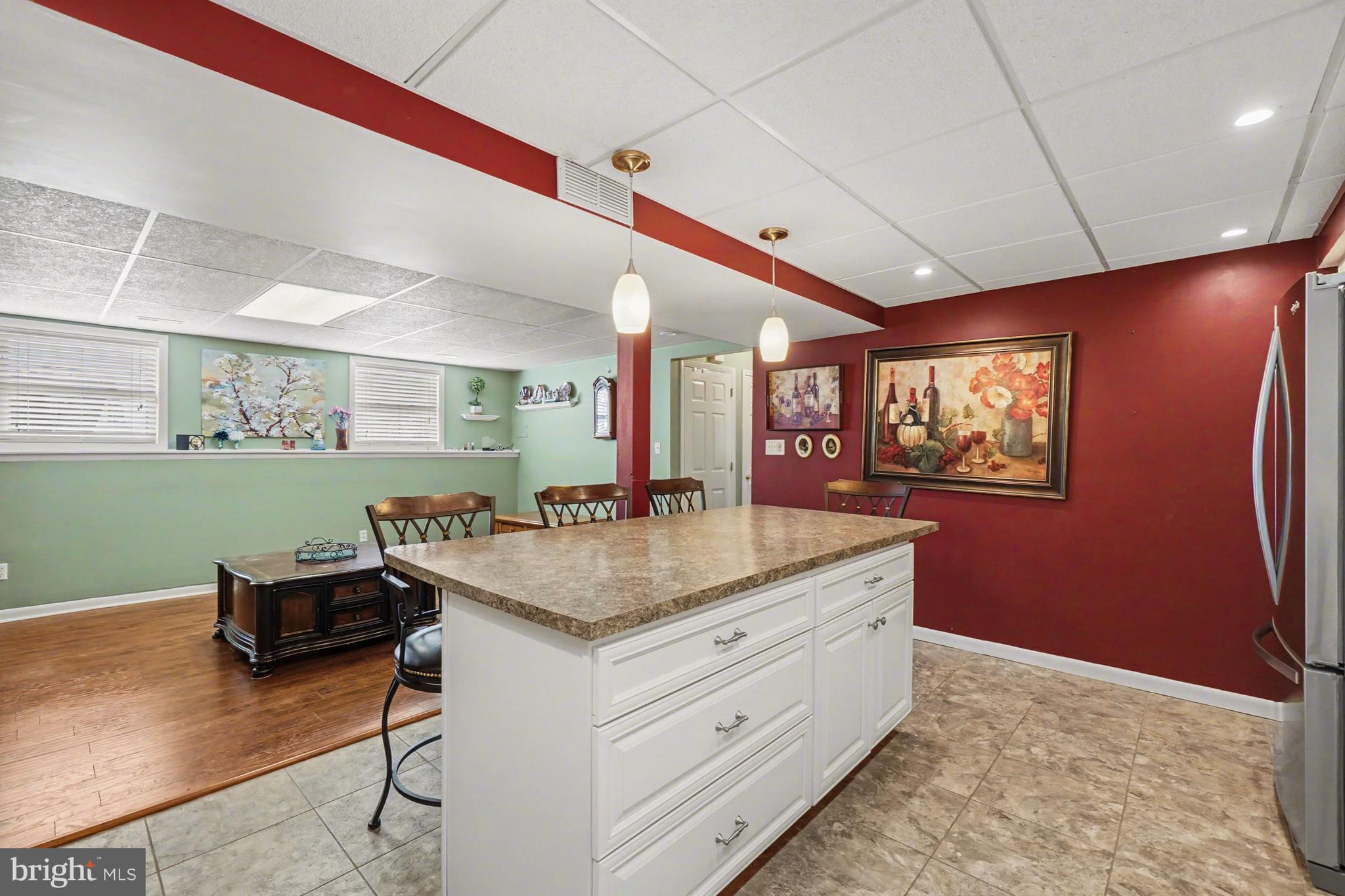 8636 Winding Way Perry Hall, MD 21128 - Photo 23 of 40 a kitchen with stainless steel appliances granite countertop a sink dishwasher and a refrigerator with wooden floor