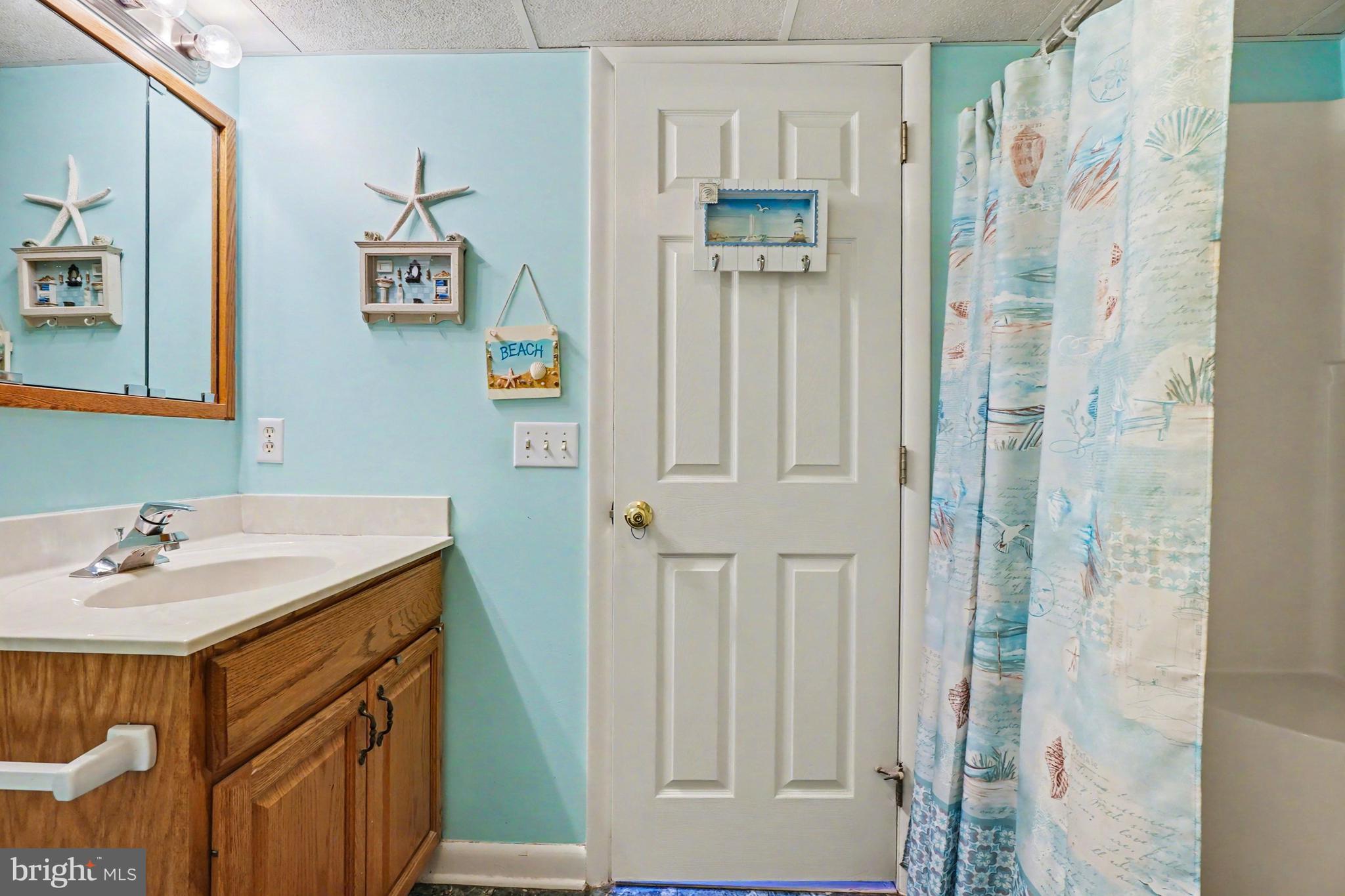 8636 Winding Way Perry Hall, MD 21128 - Photo 26 of 40 a bathroom with a sink and a mirror