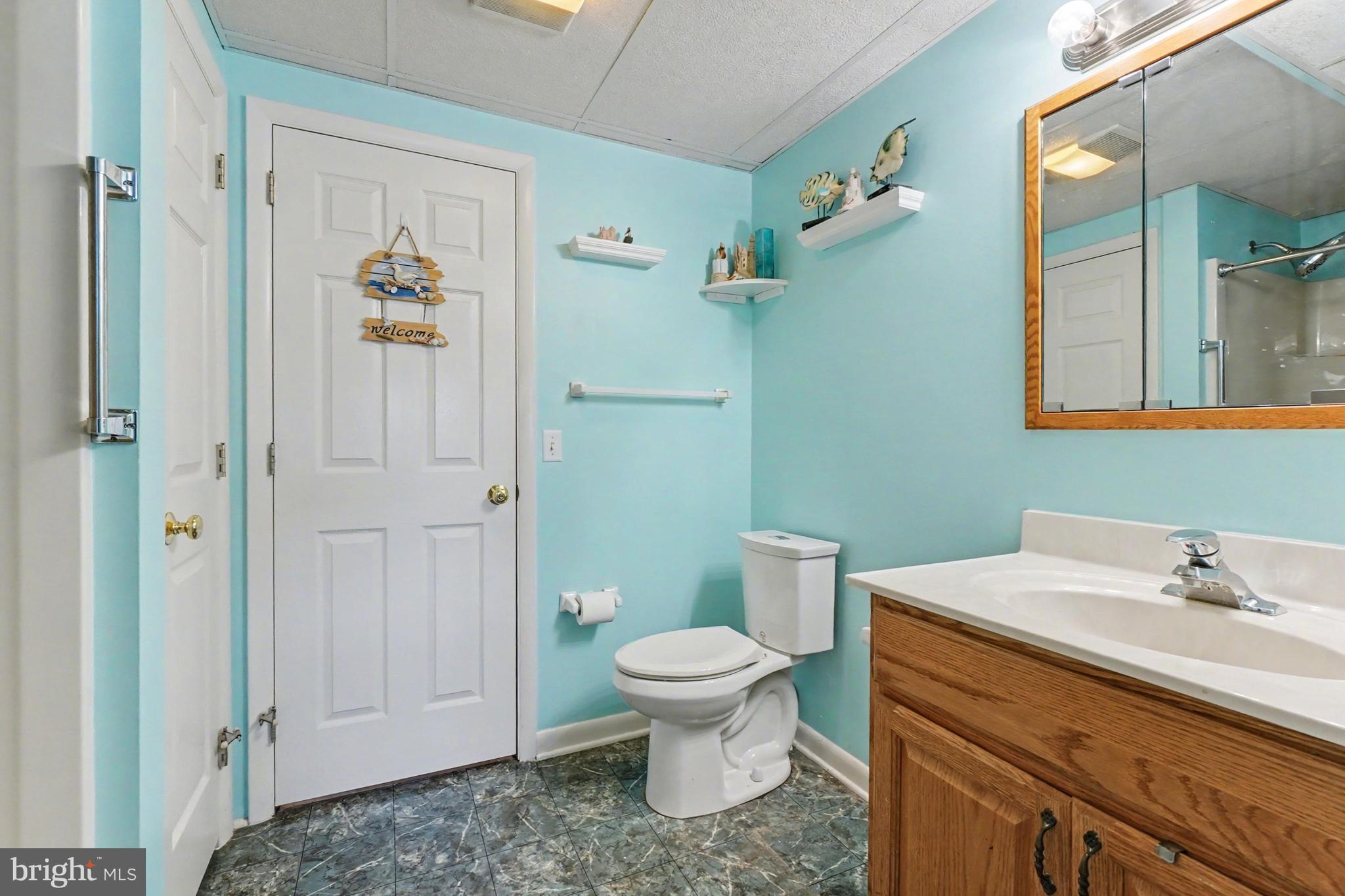 8636 Winding Way Perry Hall, MD 21128 - Photo 27 of 40 a bathroom with a sink a toilet and shower