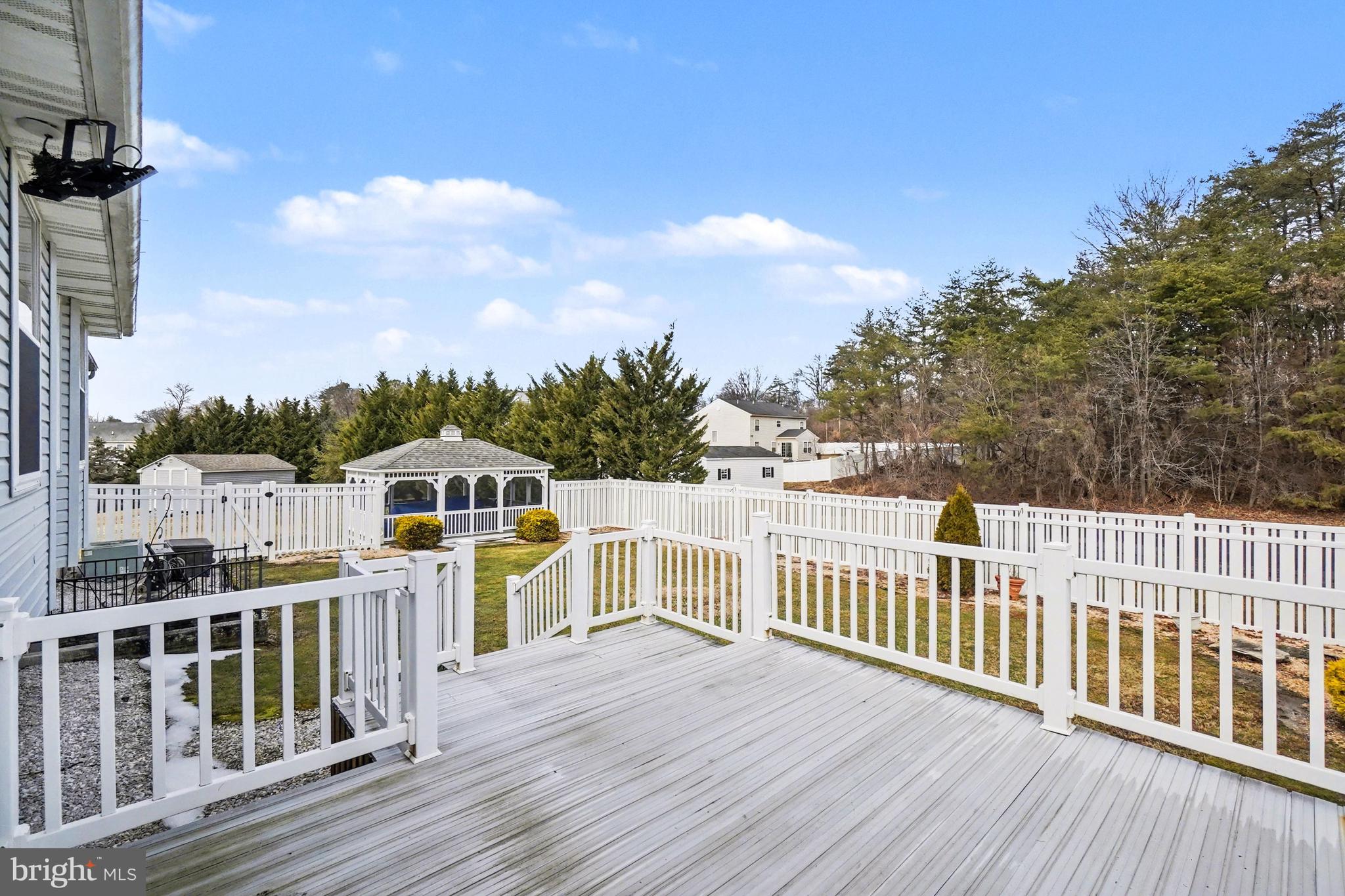 8636 Winding Way Perry Hall, MD 21128 - Photo 30 of 40 a view of a balcony with wooden floor and fence