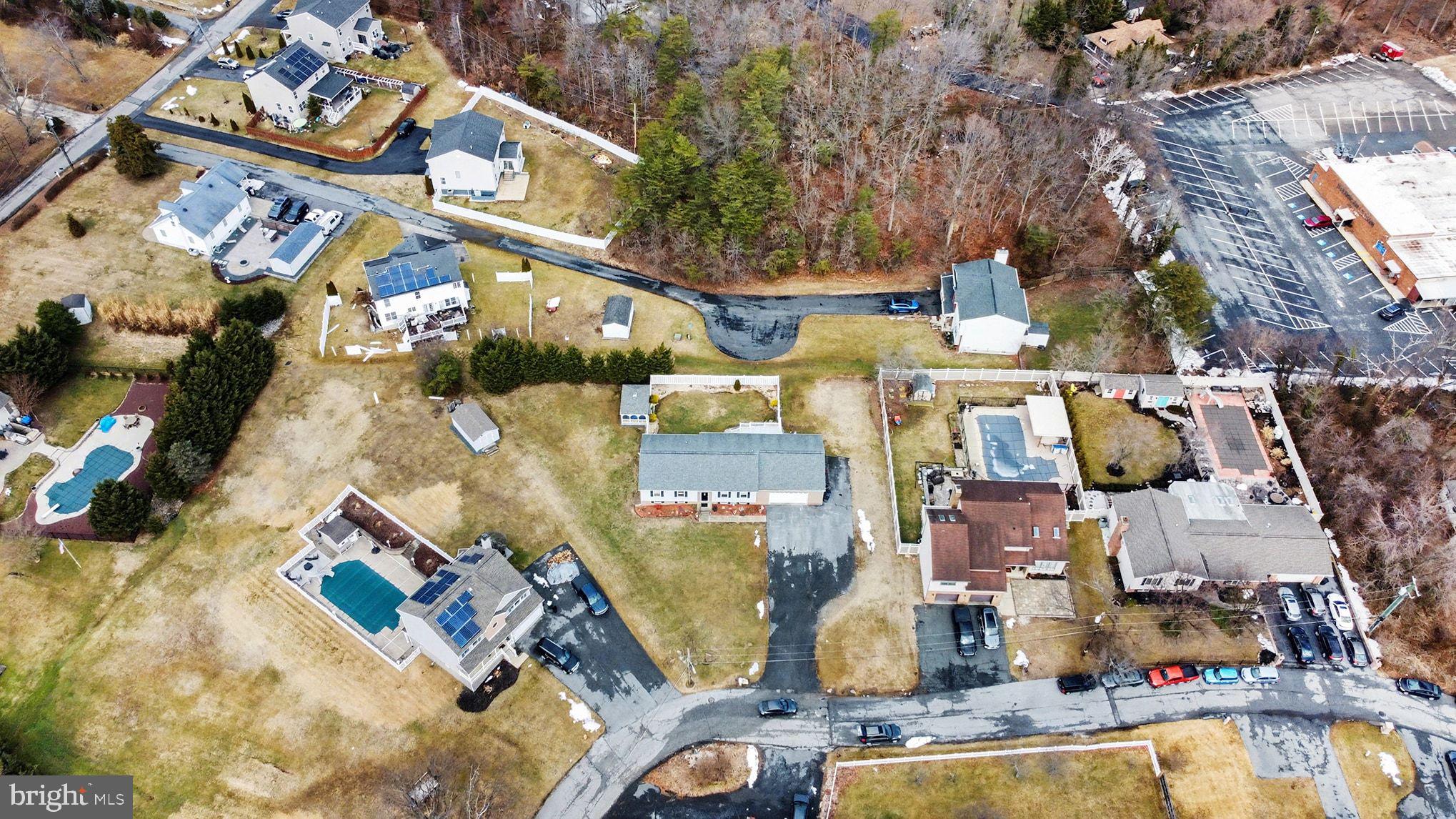 8636 Winding Way Perry Hall, MD 21128 - Photo 34 of 40 an aerial view of a house with a swimming pool