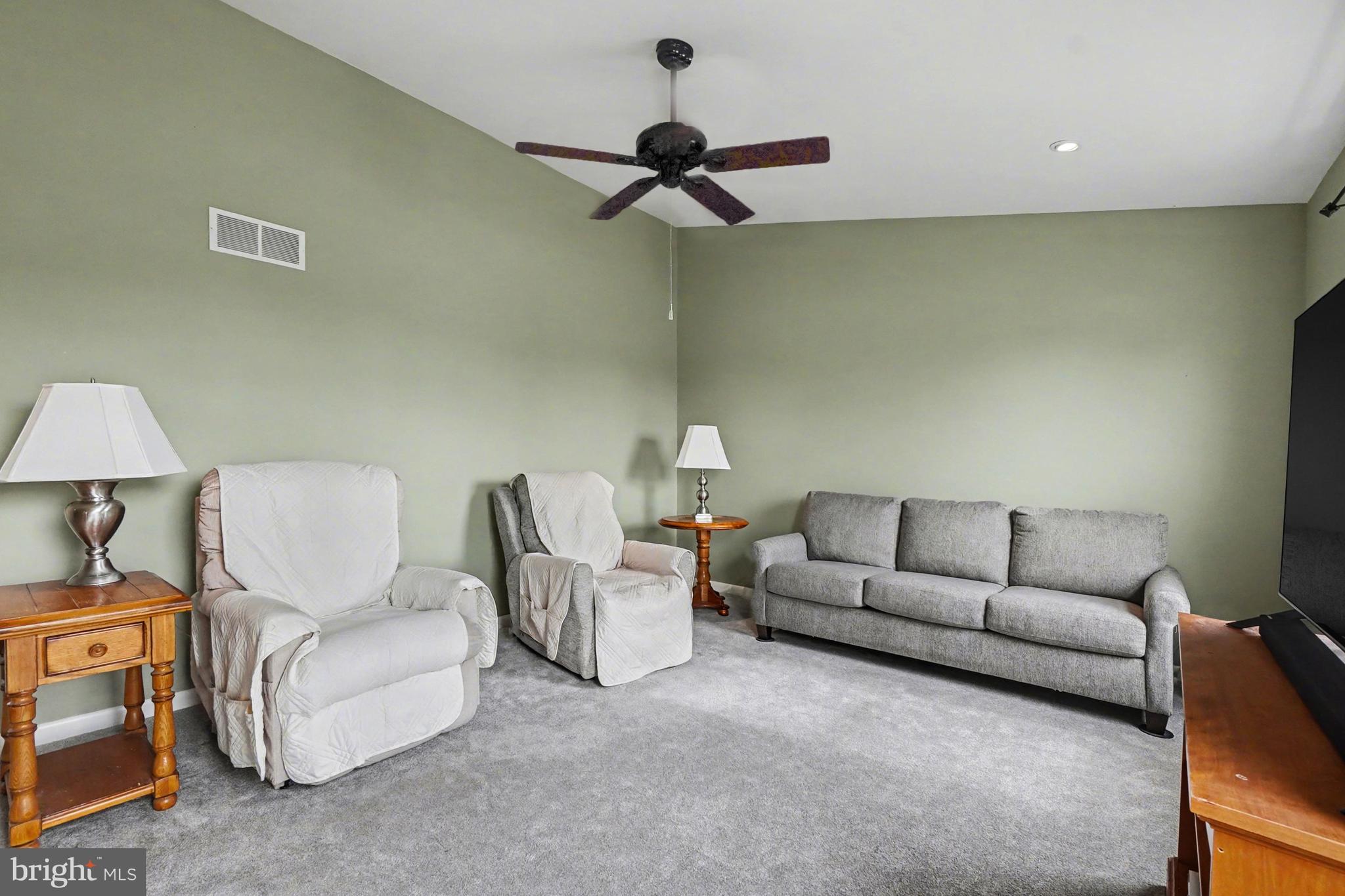 8636 Winding Way Perry Hall, MD 21128 - Photo 5 of 40 a living room with furniture a ceiling fan and a rug