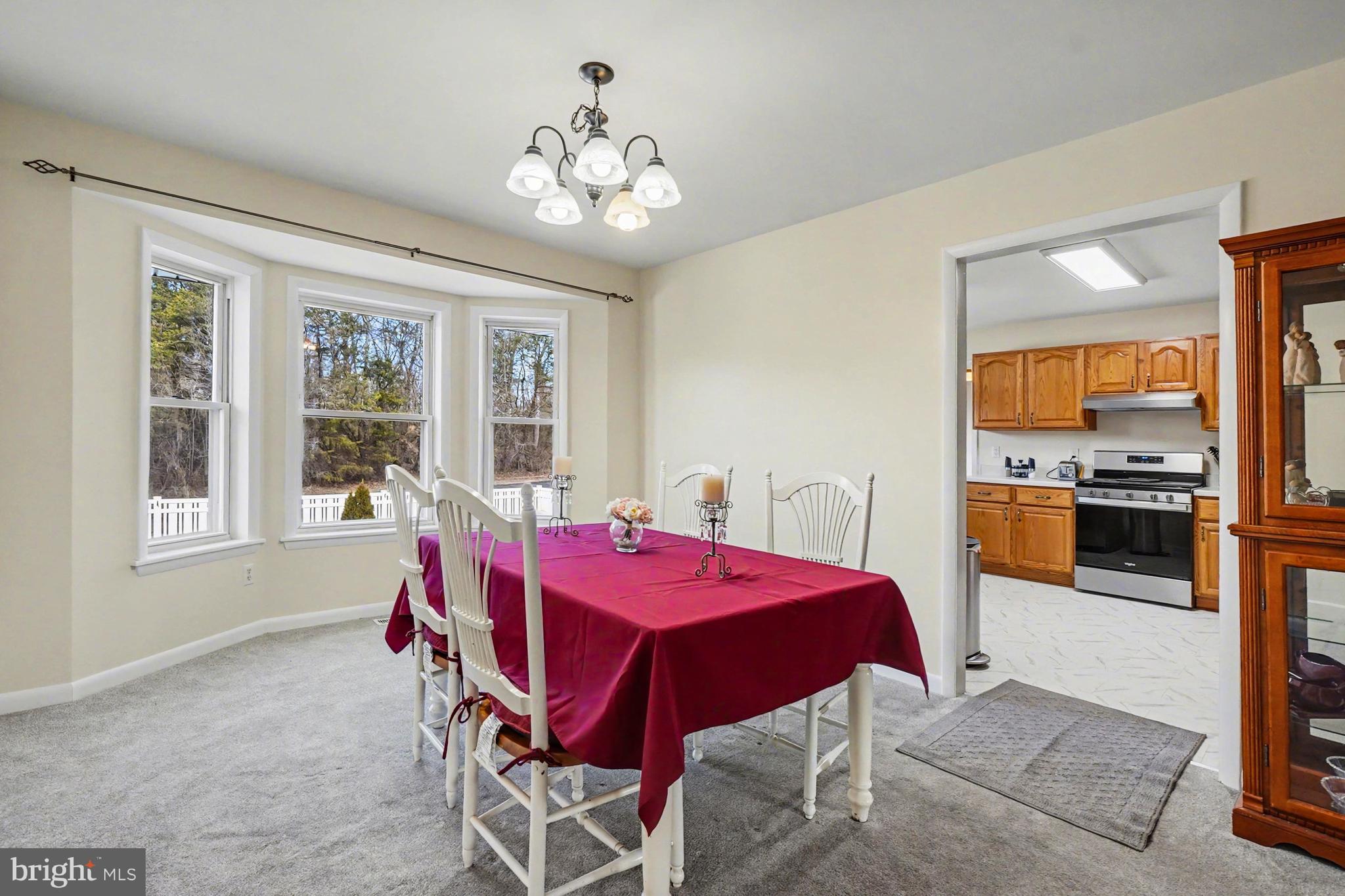 8636 Winding Way Perry Hall, MD 21128 - Photo 7 of 40 a view of a dining room with furniture and window