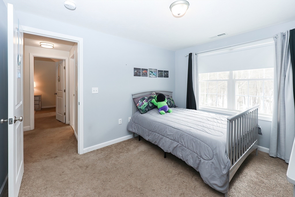 31 Bufton Farm Road Clinton, MA 01510 - Photo 21 of 37 a bed room with a bed and a window