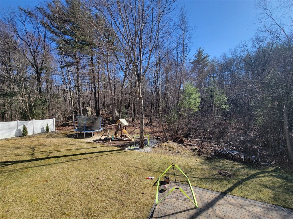 31 Bufton Farm Road Clinton, MA 01510 - Photo 32 of 37 a view of backyard with swimming pool and outdoor seating