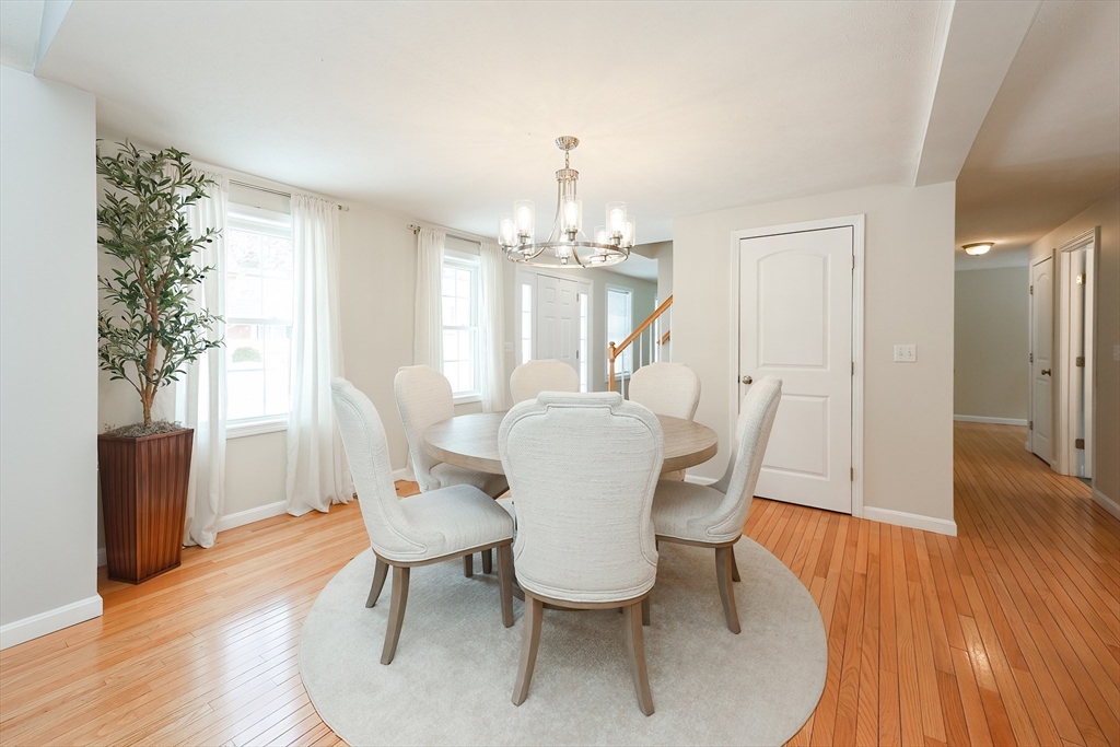 31 Bufton Farm Road Clinton, MA 01510 - Photo 10 of 37 a dining room with furniture a chandelier and wooden floor