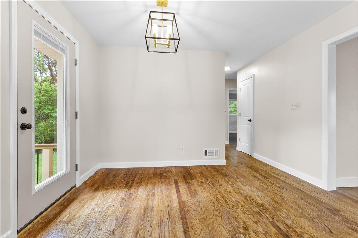 2646 Dickerson Mill Road Bedford, VA 24523 - Photo 11 of 46 a view of empty room with wooden floor and fan