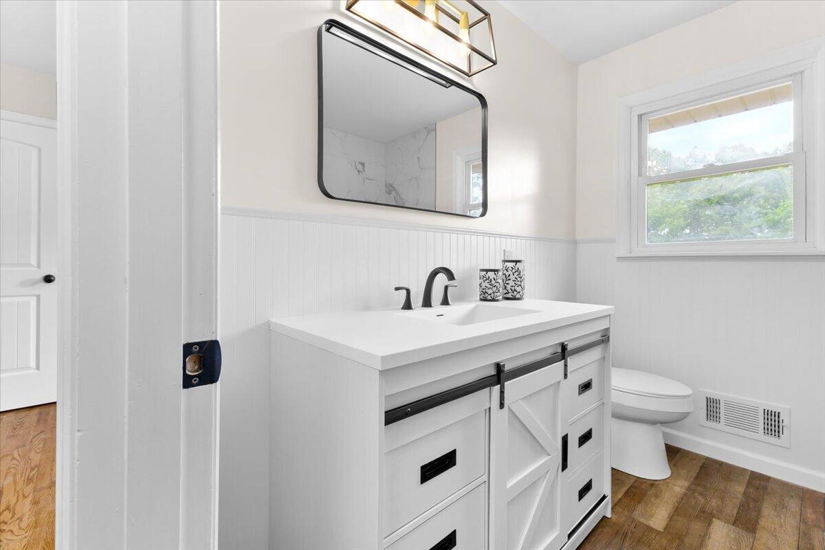 2646 Dickerson Mill Road Bedford, VA 24523 - Photo 15 of 46 a bathroom with a sink toilet and mirror