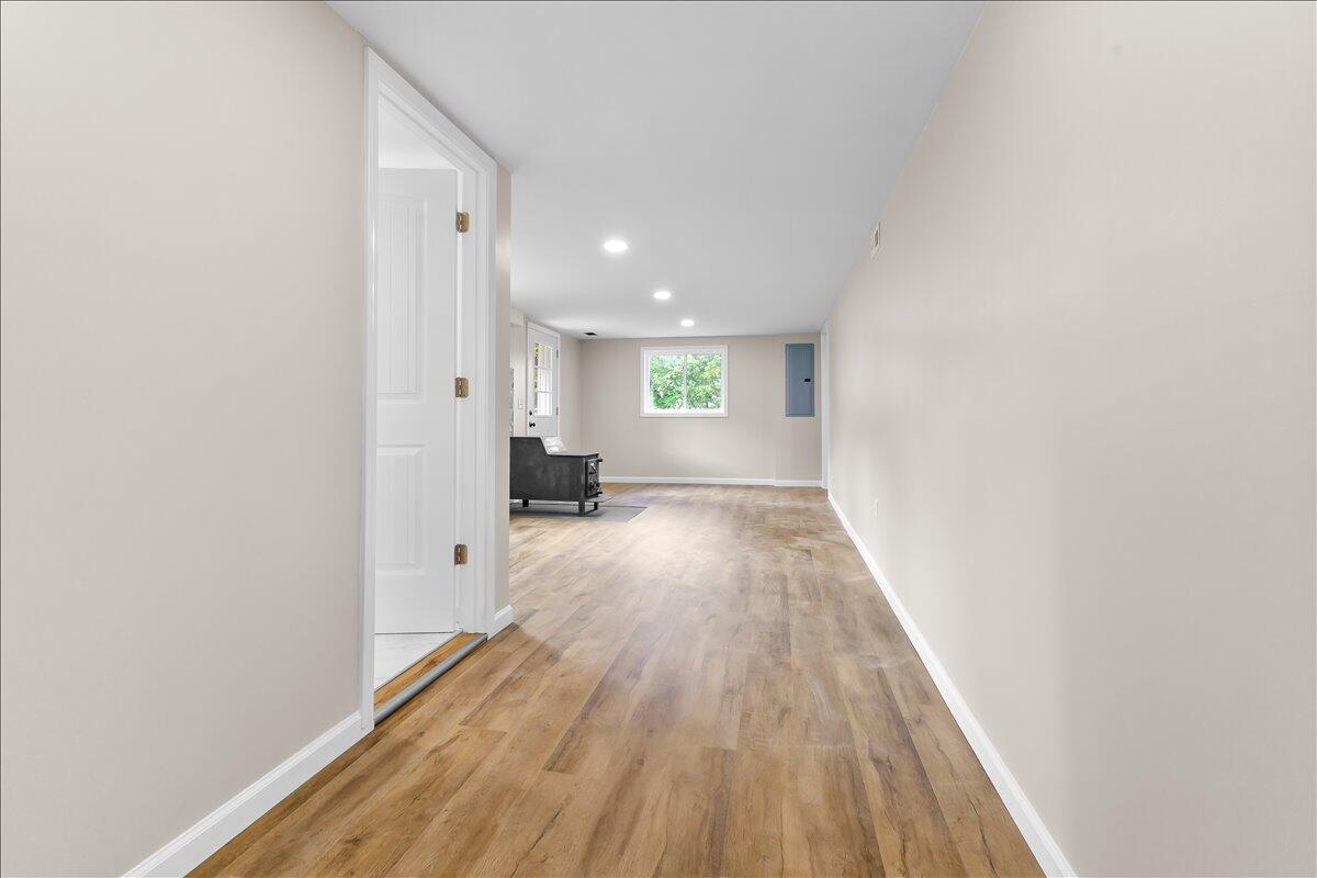 2646 Dickerson Mill Road Bedford, VA 24523 - Photo 26 of 46 a view of a big room with wooden floor and windows