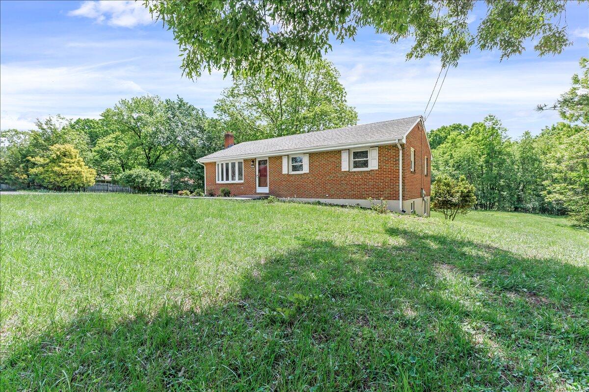 2646 Dickerson Mill Road Bedford, VA 24523 - Photo 3 of 46 a house is sitting in middle od the grass