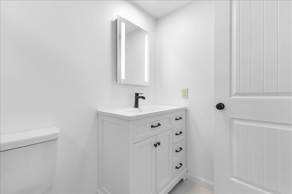 2646 Dickerson Mill Road Bedford, VA 24523 - Photo 31 of 46 a bathroom with a sink vanity and mirror