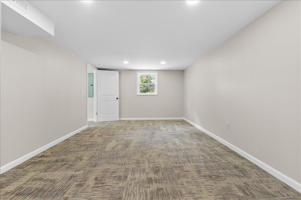 2646 Dickerson Mill Road Bedford, VA 24523 - Photo 35 of 46 an empty room with a empty space and window
